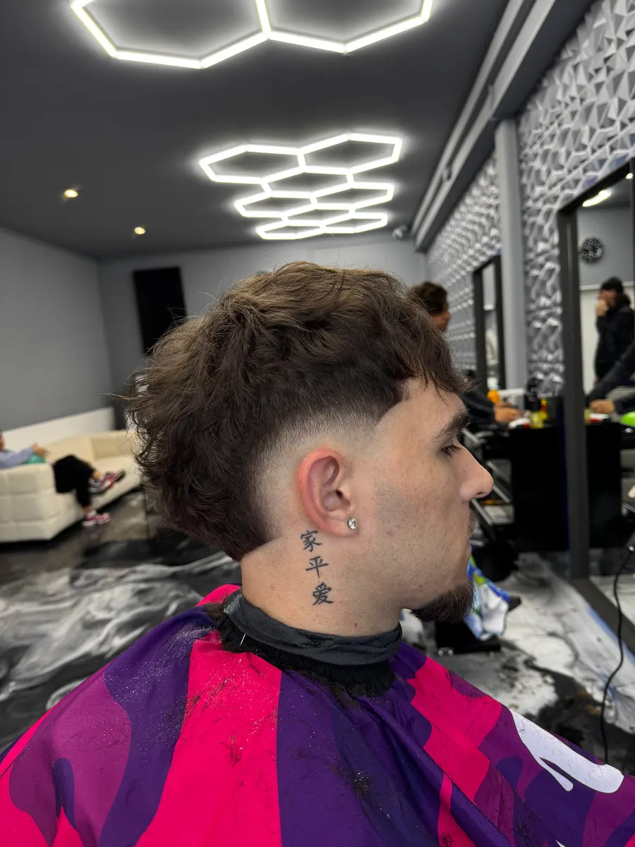 Mulet bouclé avec dégradé burst réalisé chez FLP Barber Concept